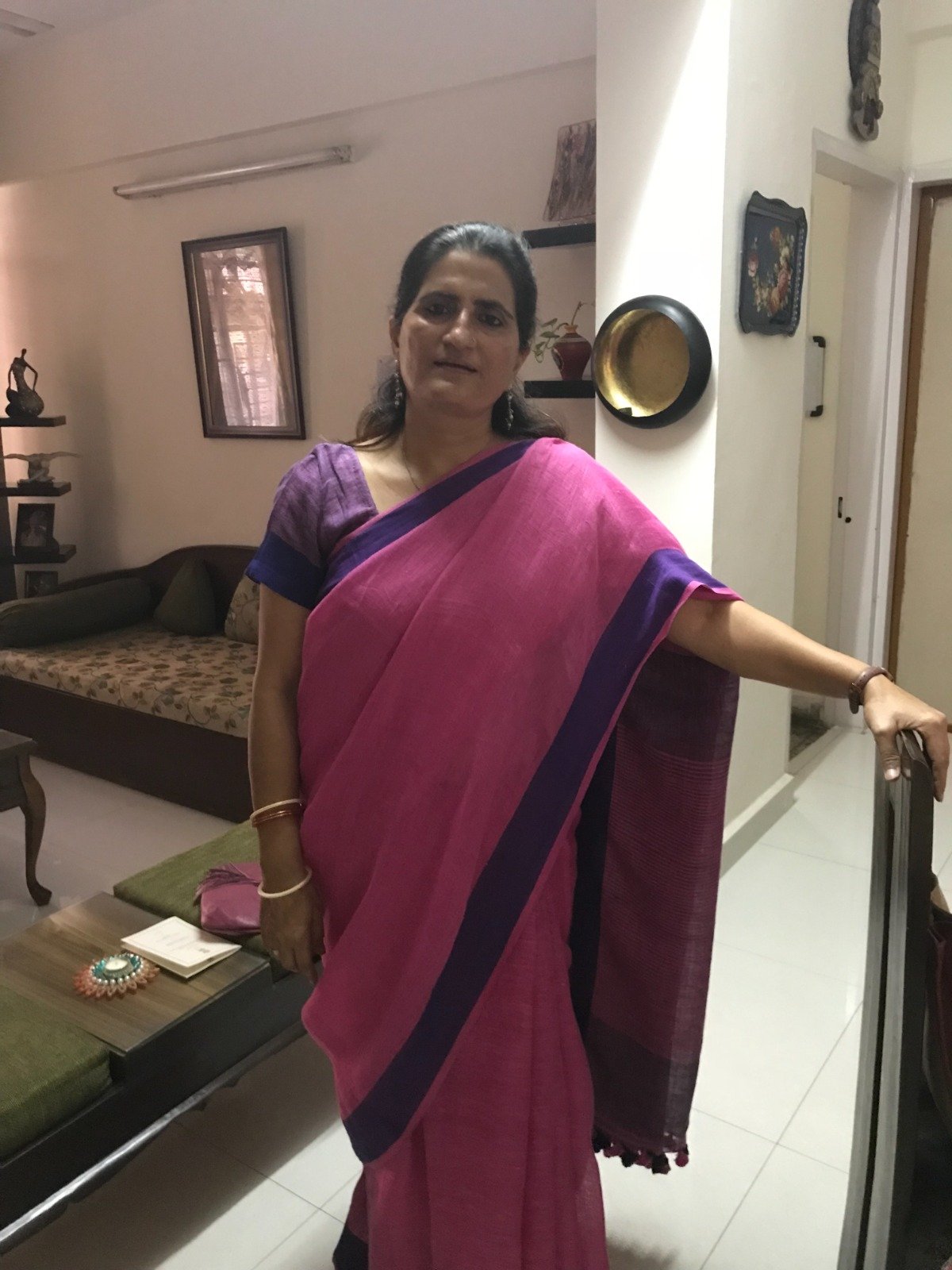 Anju Mehta in a pink Teevra saree with a purple border