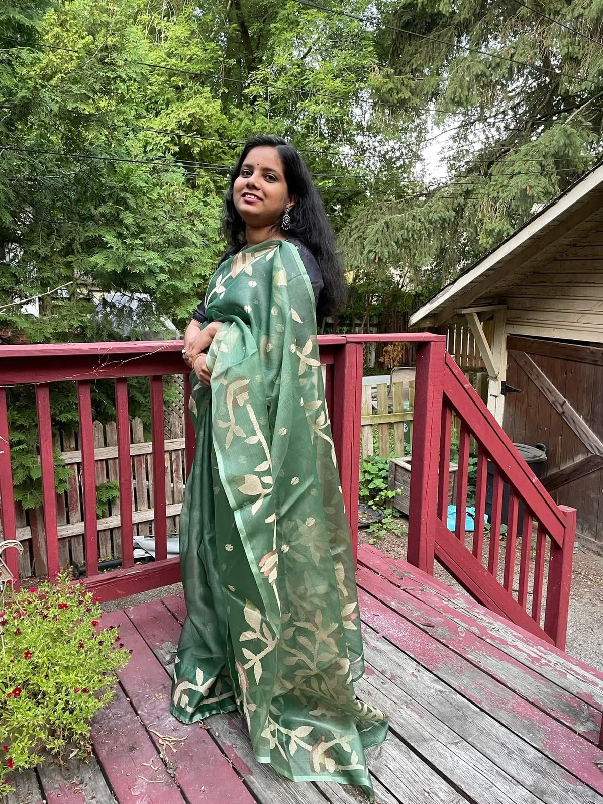 Pushpita Samina in a green leaf-print Teevra saree outdoors